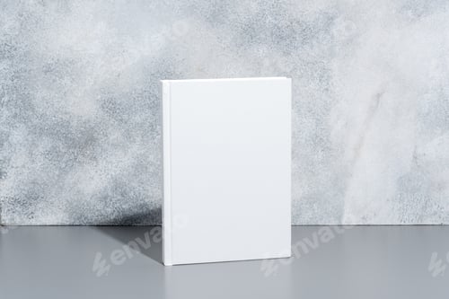 Preview: White blank book with hard cover on gray background with shadows