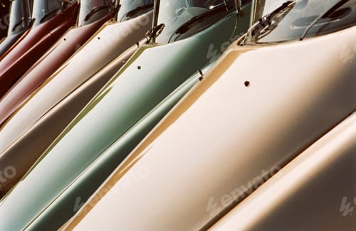 Preview: A row of vintage automobile hoods