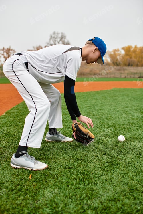 Preview: A teenage boy focuses on catching a baseball while practicing on the field