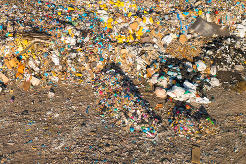 Preview: Large garbage dump with plastic bags and trash in the country. Environmental pollution concept