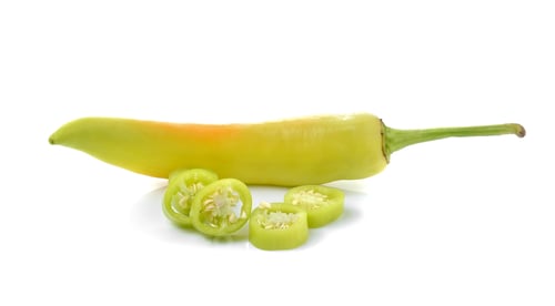 Preview: green chilli pepper on white background.