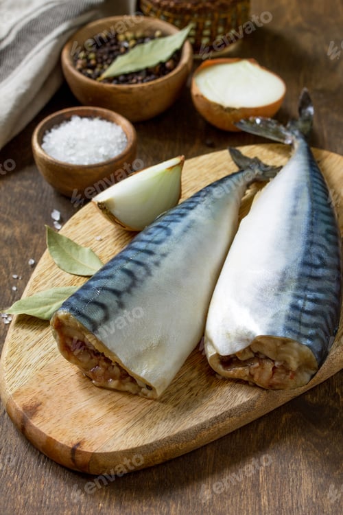 Preview: Fresh fish. Ingredients Cooking fish for Marinade. Mackerel with Salt and Spices on a wooden table.