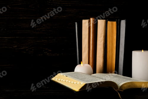 Preview: Books and candles on wooden background, space for text
