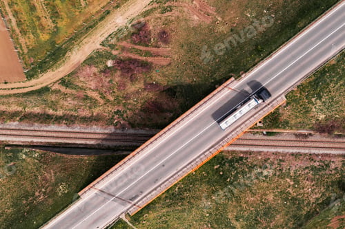 Preview: Aerial view of cistern truck on railroad overpass bridge