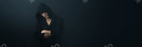 Preview: Mysterious Person in Hoodie Wide Banner with Copy Space