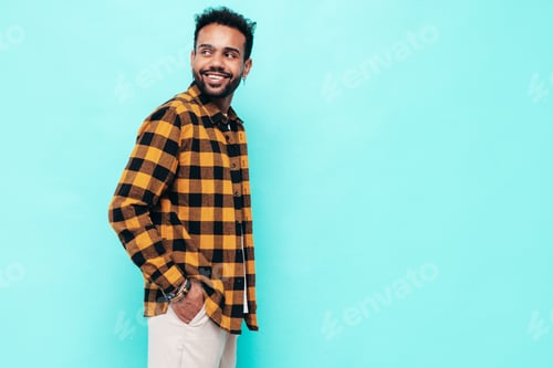 Preview: Portrait of young handsome man posing in studio
