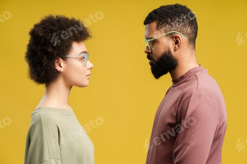 Preview: Two calm concentrated African American woman and man wearing eyeglasses