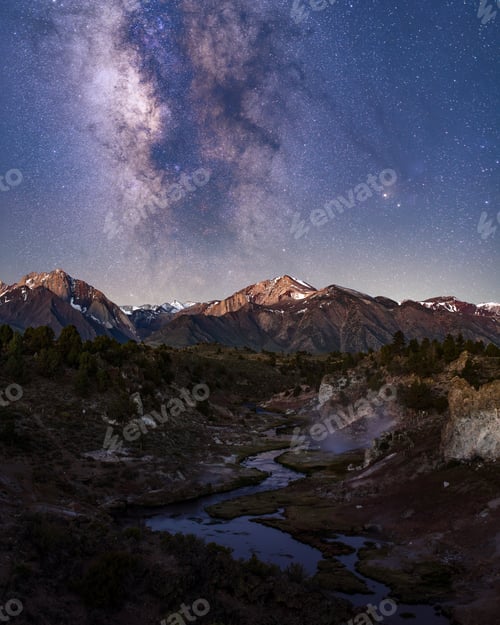 Preview: Beautiful shot of snow-covered mountains and hills with the Milky Way galaxy in a starry sky
