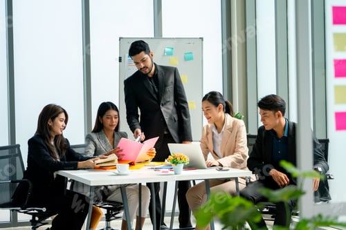 Preview: Group of business man and woman sit around the table to discuss about project with the manager