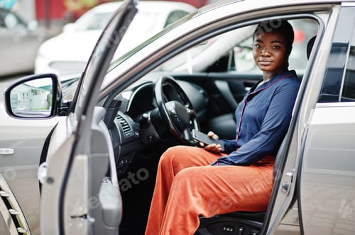 Preview: African businesswoman and car