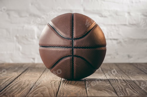 Preview: brown leather basketball ball on wooden floor
