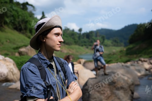 Preview: Hiker in the jungle get ready for trekking activities.
