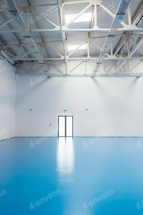 Preview: Empty sports hall with blue floor and white walls
