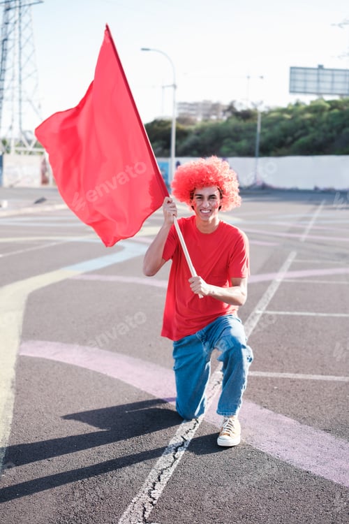 Preview: Young man carrying a flag to support his team and become a special fan for his team. Concept: fans