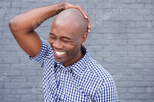 Preview: African american laughing with hand on head