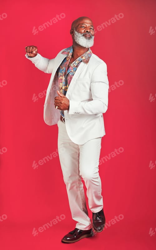 Preview: Studio shot of a man wearing vintage clothes while dancing against a red background