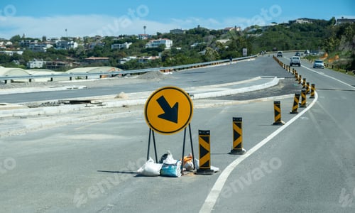 Preview: Roadworks at the highway. Warning road signs on the asphalt.