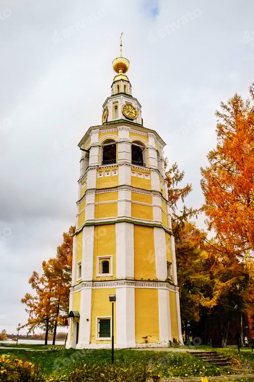 Preview: Ancient christian church and autumn yellow trees.