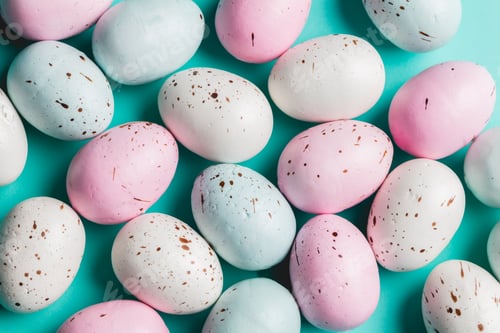 Preview: Bunch of colorful pastel eggs on blue background.