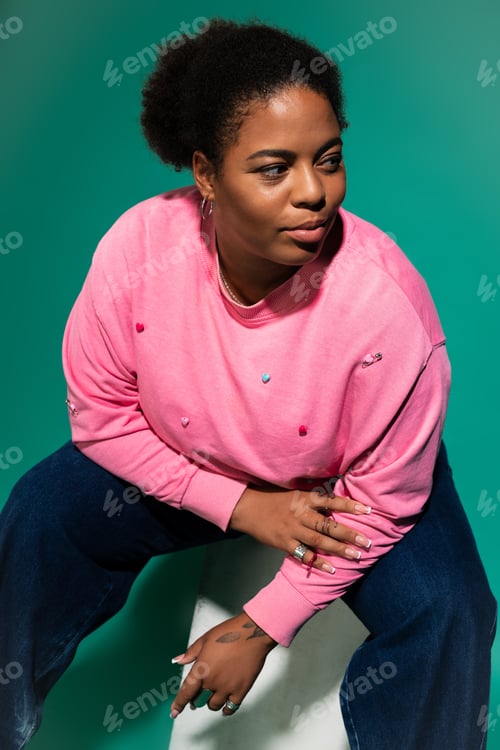 Preview: Stylish plus size African American woman radiates confidence in trendy autumn ensemble