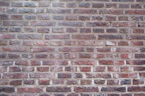 Preview: Brick wall background texture. Netherlands, faded red bricks empty brickwork .
