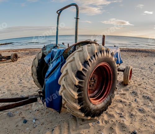 Preview: Closeup fisheye view of an agricultural tractor for taking fishing boats in and out of the sea