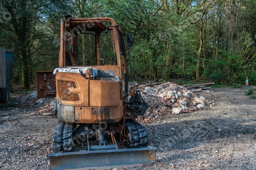 Preview: Burnt out construction digger by thieves.