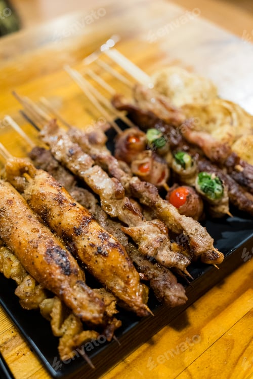 Preview: Variety of meat skewers on dish