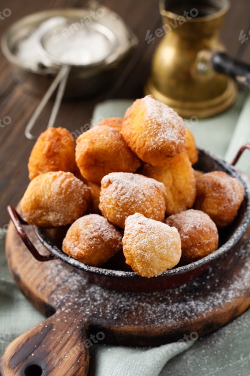 Preview: Little Donuts. Homemade curd fried cookies in deep fat and sprinkled with icing sugar in a vintage p