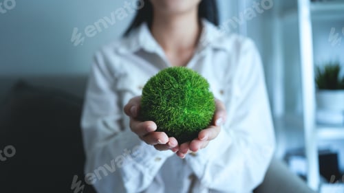 Preview: A woman is holding a green ball in her hand