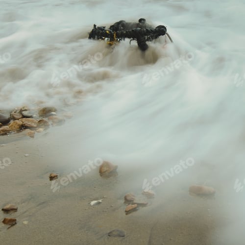 Preview: Long exposure shot of a fishing basket in the wet sand