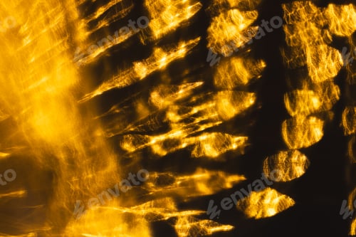 Preview: Yellow bokeh blurred lights with copy space on dark background