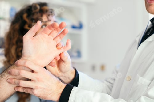 Preview: Healthcare Professionals Diagnosing Hand Trauma in Clinic