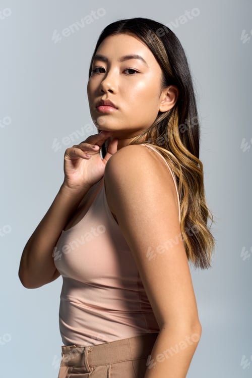 Preview: A Woman's Confident Gaze in a Studio Portrait