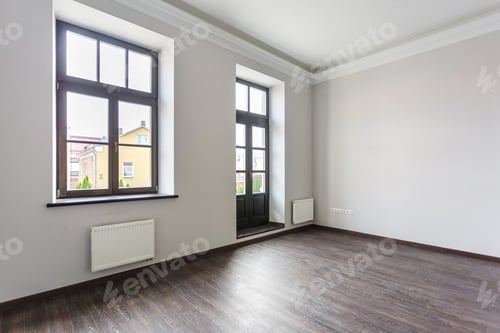 Preview: Side view of unfurnished room loft interior with wooden floor, white walls with bright daylight