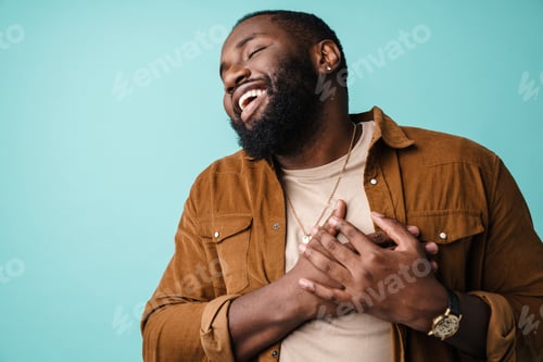 Preview: Happy african american man posing with hands on his chest