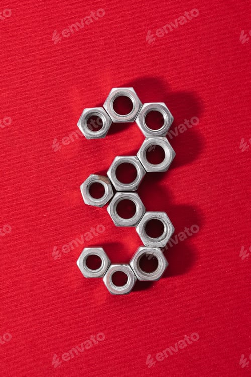Preview: number three, made with steel nuts on red fabric background