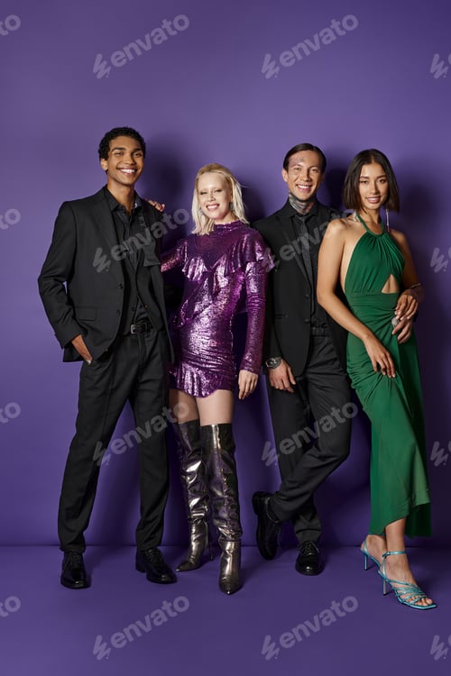 Preview: Christmas party, joyful multiethnic male and female friends in festive attire hugging on purple