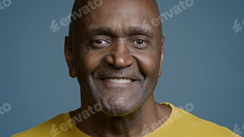 Preview: Male portrait mature african american man looking camera smiling with white toothy smile joyful