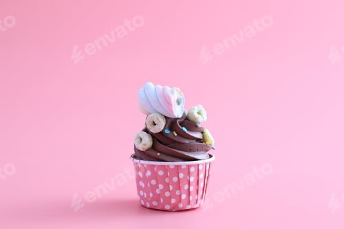 Preview: Chocolate Cupcake Isolated In Pink Background