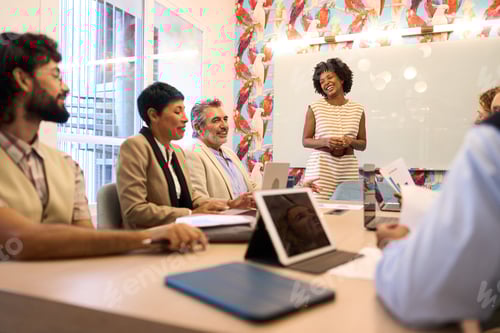 Preview: Diverse business team collaborating during office presentation