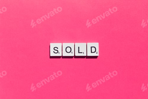 Preview: Sold scrabble letters word on a pink background