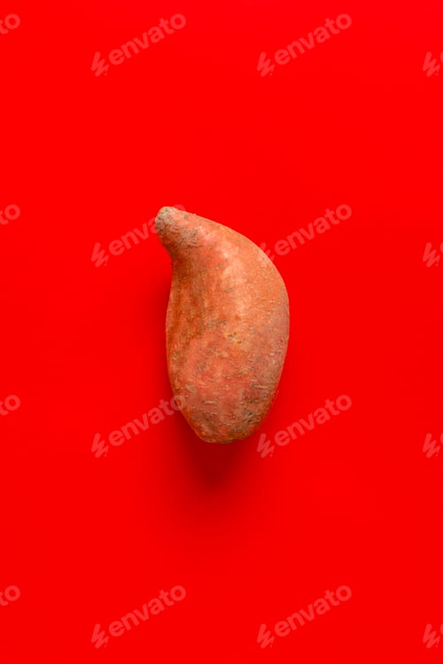 Preview: raw sweet potato or batat flat lay isolated, minimal simple concept of healthy nutrition diet