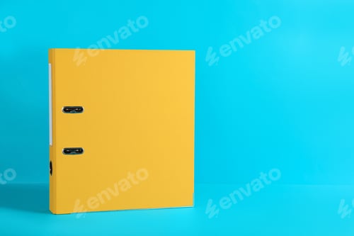 Preview: Yellow office folder on light blue background, space for text