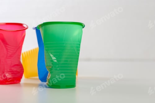 Preview: Multicolor disposable plastic glasses isolated on white background