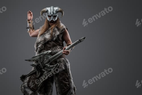Preview: Crazy viking from past playing guitar against grey background
