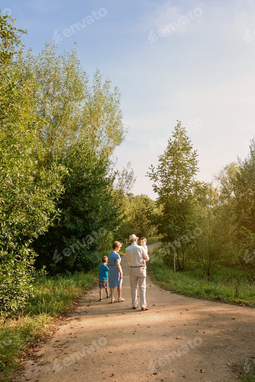 Preview: Grandparents and grandchildren walking outdoors