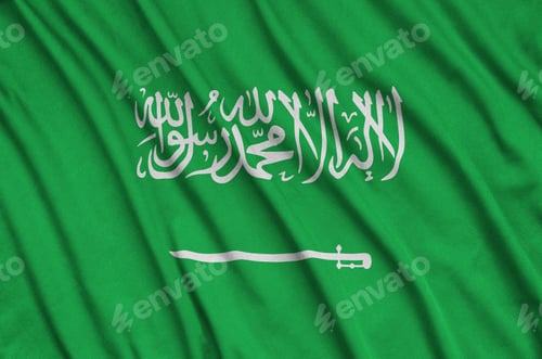 Preview: Saudi Arabia flag is depicted on a sports cloth fabric with many folds. Sport team waving banner