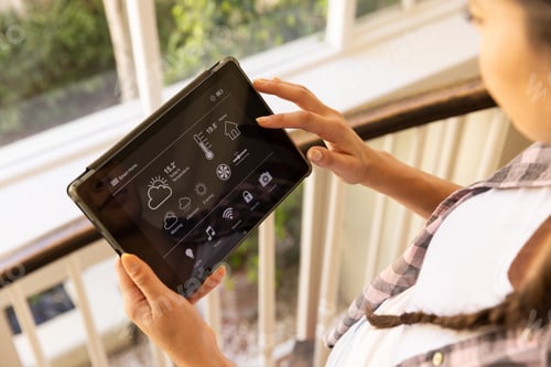 Preview: Using tablet, woman controlling smart home system with various settings