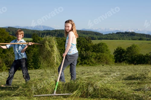 Preview: Boy and girl raking lawn